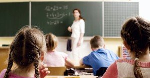 Children in Classroom with Teacher at Board