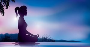 Woman Meditating on Beach