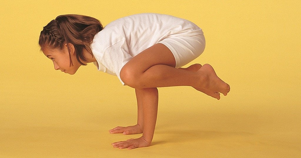 girl in crow pose